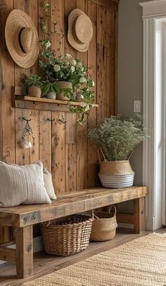 a wooden bench sitting next to a wall with hats on it