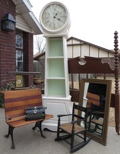 an old fashioned rocking chair next to a grandfather clock