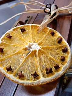 an orange cut in half sitting on top of a wooden table