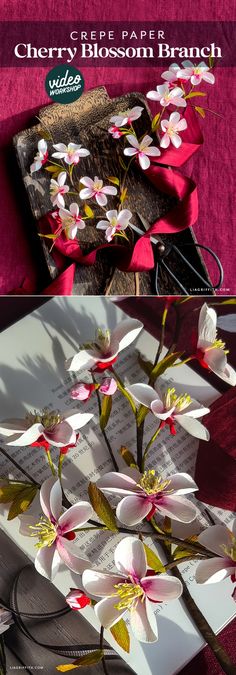 paper flowers are placed on top of an open book with the title cherry blossom branch