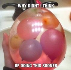 an image of someone holding balloons in front of their face and the caption says, why didn't i think of doing this soon?