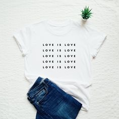 Love is love shirt. Please refer to our size chart in the thumbnails for exact dimensions. Customization: If you want a custom shirt with your text or drawing, please contact us. In case you have any questions, just drop us a line and we will give you 110% of our support. Product information: The sleeves are rolled up for display purposes only. In photos you see Unisex style T-shirt. 100% Cotton Preshrunk Jersey knit  Reinforcing tape on neck Rib collar Short sleeves Washing and drying instructi Lgbt T Shirts, Love Wins, Custom Made Shirts, Graphic Quotes, Kindness Shirts, Love Is Love, Pride Tshirts, Gift Quotes, Love Shirt