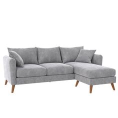 a gray sectional couch with pillows on the back and armrests, in front of a white background