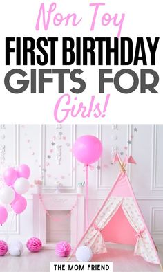 a pink teepee tent with balloons and streamers in front of it that says non - toy first birthday gifts for girls