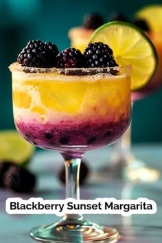 blackberry sunset margarita with lime and blackberries