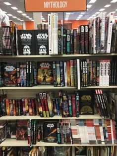 the bookshelf is full of star wars and other movie related items for sale