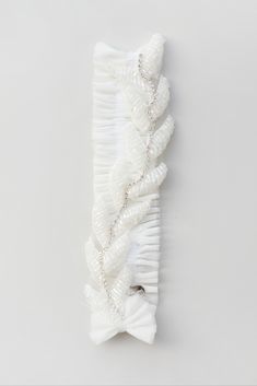 Elevate your bridal ensemble with our Shiny Leaves Ivory Wedding Leg Garter. A delightful gift from bridesmaids to the bride, this garter adds a touch of glamour to her special day. The ivory color and shiny leaves design make it a charming keepsake. It's a perfect accessory to complete the bridal look and celebrate your wedding in style. #BridalGarter #WeddingAccessory #IvoryGarter Wedding Leg Garter, Leg Garter, Bridal Accessory, Wedding Garters, Leaves Design, Bridal Garter, Bridal Look, Ivory Wedding, Garters