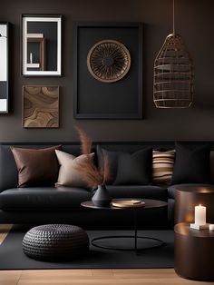 a living room filled with black furniture and pictures on the wall above it's coffee table