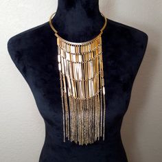 This Golden Metal Bib Fringe Drop Chocker Necklace Is The Perfect One For Parties And Music Festivals. It Will Make You Stand Out In A Crowd Of Hundreds. Gold Layered Party Necklace, Gold Bib Necklace With Adjustable Chain For Party, Gold Bib Necklace With Chain For Gift, Gold Bib Necklace As A Gift, Gold Dangle Chain Choker, Bohemian Gold-tone Necklaces For Party, Gold Metal Bib Necklace With Adjustable Chain, Gold Metal Dangle Layered Necklace, Gold Metal Dangle Choker