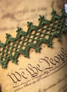 an old book with crocheted lace on it