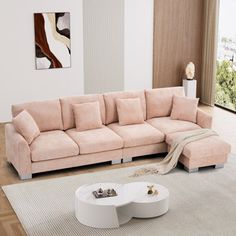 a living room with a sectional couch and coffee table