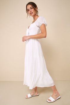 Pack up a gorgeous picnic and head to the park for a day in the sun with the Lulus Darling Concept White Tiered Tie-Front Puff Sleeve Midi Dress! Gauzy, lightweight woven fabric shapes this summer-ready dress that has short puff sleeves (with elastic at the cuffs and shoulders) and a tie-front bodice with a sweetheart neckline, a cutout detail, and lace trim. Fitted waist tops a tiered skirt that falls to a midi hem. Hidden zipper/clasp at back. Fit: This garment fits true to size. Length: Mid-c White Wedding Guest Dresses, Boho Western Outfits, Engagement Photo Dress, Puff Sleeve Midi Dress, Casual White Dress, Pack Up, Engagement Outfits, Tiered Midi Dress, Dress With Tie