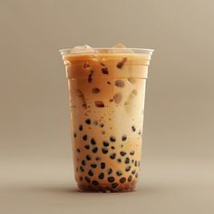 a drink in a plastic cup with black dots on it