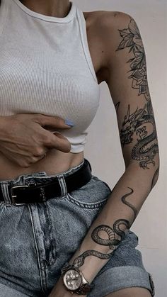 a woman with a tattoo on her arm