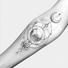 an arm tattoo with the moon, stars and planets on it in black and white