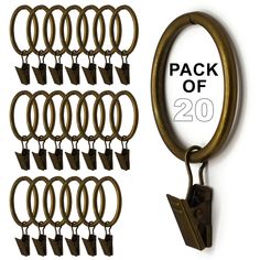 a bunch of metal rings hanging from hooks on a white wall with the words pack of 20