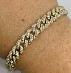 "Beautiful Pave Link Bracelet Yellow Gold set with sparkling diamonds.  Feels nice and solid 22.72 grams of solid gold.  The back of the bracelet is smooth shiny gold. This bracelet is like a buy one get one free.  Lol. You can wear the diamond side or flip the bracelet over and wear on the plain gold side on more casual days.  Measures 8mm width.  The lock is nice and secure with safety latch.  The diamonds are set nice and smooth.  Excellent craftsmanship.  7\" length.   Genuine earth mined round brilliant cut diamonds  Total weight: 3.85 Carats Clarity: SI/ I Color: G All shiny diamonds, no cloudy or yellowish stones  Solid 14K Gold 22.72 grams  Comes with gift box * We have been in the wholesale Jewelry business for over 30 years serving the community at the same location.  All diamond Luxury Yellow Gold Chain Bracelet With Single Cut Diamonds, Yellow Gold Iced Out Cuban Link Bracelet, Luxury Iced Out Yellow Gold Diamond Bracelet, Yellow Gold Diamond Cuban Link Bracelets, Gold Cuban Link Tennis Bracelet With Diamond Accents, Gold Tennis Bracelet With Diamond Accents And Cuban Link, Gold Diamond Cut Cuban Link Bracelet, Yellow Gold Cubic Zirconia Link Diamond Bracelet, Yellow Gold Cubic Zirconia Diamond Link Bracelet