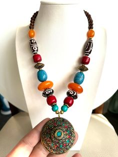 This beautiful and vintage Tibetan style handmade necklace with pendent inlaid with Coral and turquoise and made from Amber resin and yak bone  with Tibetan silver. This beautiful necklace is 23"inches long and weighs around 108 grams made in Nepal by skilled artisan. Great piece to add your jewelry collection from Asia.Thanks Gaya Bihar, Hippy Jewelry, Bodh Gaya, Golden Arrow, Tibetan Necklace, Amber Resin, Tibetan Jewelry, Indian Necklace, Brass Beads