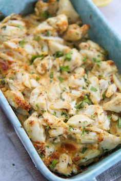 a casserole dish with chicken, cheese and herbs