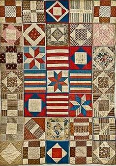 an old quilt with many different colors and patterns on the front, including red white and blue