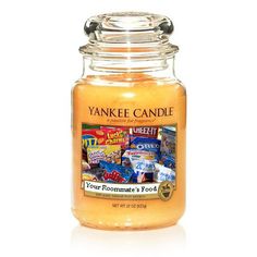 yankee candle jar filled with an assortment of foods and candy on it's lid