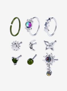 six pairs of rings with different shapes and colors are shown in various positions on a white background