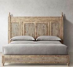 a bed with wicker headboard and foot board