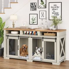 two dogs are sitting in their kennels under the stair case on the floor