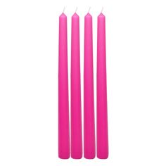 three pink candles sitting next to each other