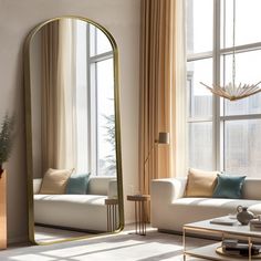 a living room filled with furniture and a large mirror in the middle of the room