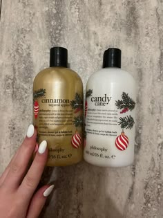 two bottles of body lotion sitting next to each other