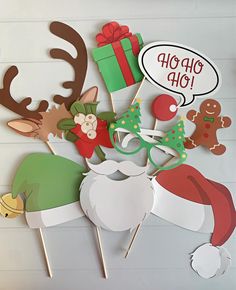 a group of christmas themed items on sticks