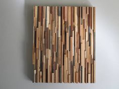 a piece of wood that has been made into a wall hanging on the side of a wall