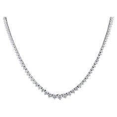 15.50 Carat Total Natural Graduated Diamond Riviera Necklace in Platinum. This unisex necklace features 134 individual natural round brilliant cut white diamonds. Together, the diamonds carry a weight of 15.50 carats. The larger diamonds measure 5.5 mm each, and the smaller ones measure 3 mm each. Offering a classic riviera setting where the diamonds gradually get larger towards the largest center stone in the middle. All set in a platinum 900 4 prong setting, 18 inches in length. Item Details: Riviera Necklace, Unisex Necklace, Tennis Necklace, Metal Necklaces, Round Brilliant, Diamond White, Prong Setting, Natural Diamonds, Jewelry Necklace Pendant