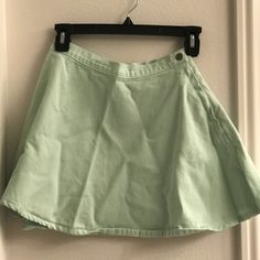 Never Worn Spring Cotton Skort, Cotton Skort For Spring, Green Casual Cotton Skirt, Fitted Green Cotton Tennis Skirt, Green Cotton Tennis Skirt For Spring, Green Cotton Pleated Mini Skirt, Casual Skirted Skort For Spring, Casual Relaxed Tennis Skirt For Spring, Summer Green Tennis Skirt With Pockets