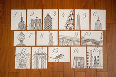 the numbers are drawn on paper and placed in front of each other with pictures of different buildings