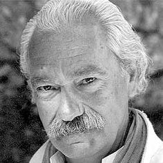 black and white photo of an older man with grey hair, wearing a shirt and tie