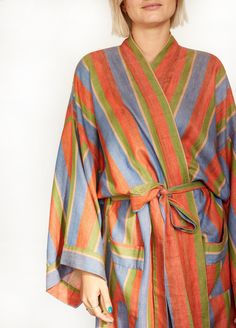 Step into our super-soft, richly hued, 100% cotton long robe in Soak, a soothing blend of blue, red, and green. Ethically handwoven on looms in India, this robe keeps you cozy and cool with stripes that stand out. Complete your after-bath look with the matching hair wrap, scrunchie, and make-up bag. It's worth getting out of the tub for, we promise. Product Details: 100% cotton Unisex, one size: 49" length, 27" shoulder (across back), 28" waist (across back), 14" drop sleeve Fits up to size US d Bathrobes For Women, Hair Towel Wrap, Linen Robe, Djerf Avenue, Red Dress Makeup, Haikou, Linen Summer, Hair Wraps, Dress Home