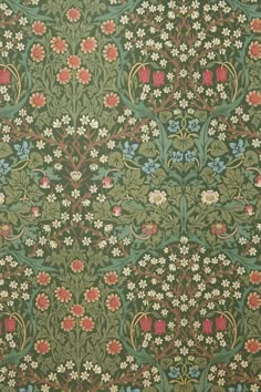 an old wallpaper with flowers and vines on green background, from the late nineteenth century