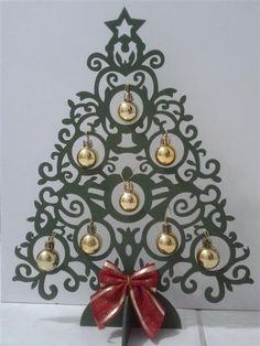 a small christmas tree with bells on it