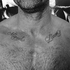 a shirtless man with his name tattooed on his chest