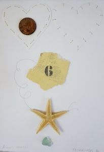 a starfish and some other items are on the table next to a dime coin