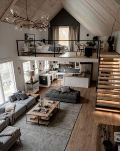 a living room filled with furniture and a loft