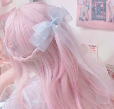 a close up of a person with pink hair wearing a white dress and a bow