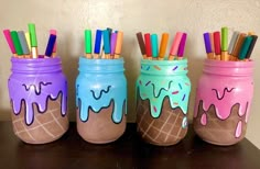 three jars with ice cream and colored pencils in them