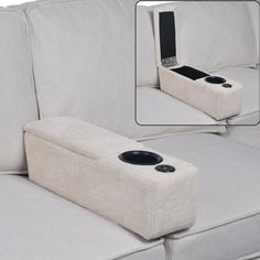 a white couch with two speakers attached to it's armrests and the seat is empty