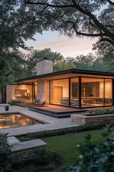 Modern single-story home exterior with flat roof, large windows, wood siding, and stone accent wall Modern 1 Story House, French Modern Home Exterior, Modern Home Exterior Design, French Modern Home, Home Exterior Design Ideas, Minimalist Landscaping, Modern Home Exterior, Home Exterior Design, Exterior Design Ideas