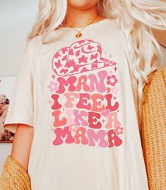 a blonde woman wearing a t - shirt that says man i feel like a bride