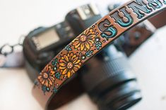 a camera with a leather strap that says stut - out on it's side