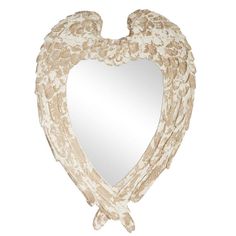 a heart shaped mirror with wings hanging from it's sides, against a white background